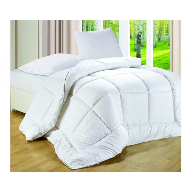 Pampering winter set featuring a double duvet and a pair of down pillows and a multi-time vacuum bag gift for storing free shipping