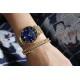 שעון יד לאישה מבית The Duchesses מוזהב עם לוח כחול מסדרת Berlin משלוח חינם
